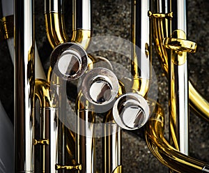 Detail on the flaps of the brass sheet music instrument