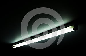 Detail of a fluorescent light tube on a wall