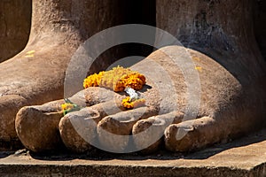 Detail of foot of Buddha statue in Sukhothai Historical Park, Thailand