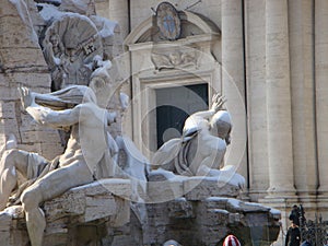 Fountain of the four rivers with the snow to Rome in Italy.