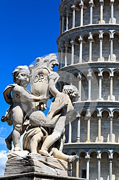 Detail of the Fountain Putti Fountain and the Leaning Tower of Pisa at the Piazza dei Miracoli in Pisa, Tuscany, Italy