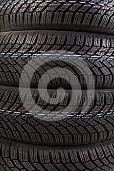 Detail of four winter tires stack background