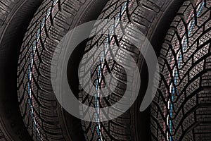 Detail of four winter tires stack background