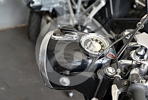 Detail of front light and speedometer of old motorbike