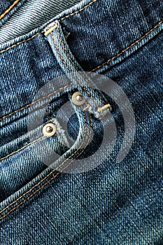 Detail of a front pocket of a blue denim