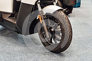 Detail of the front wheel of an utilitary motorbike photo