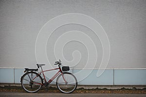 Detail of a frost-covered bicycle leaning on a wall