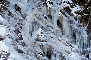 Detail of frozen waterfall with many icecles.