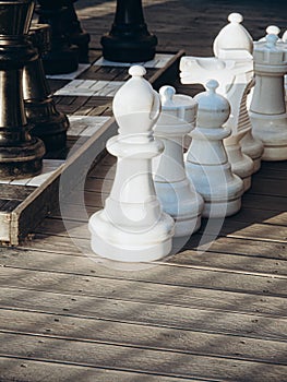 Detail gigantic chess outdoors on a sunny day