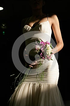 Detail of girl with wedding dress and bouquet of flowers 2.