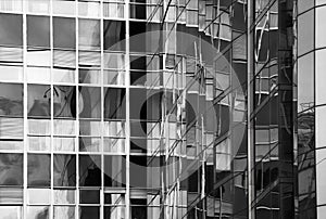Detail of glass building facade with reflections