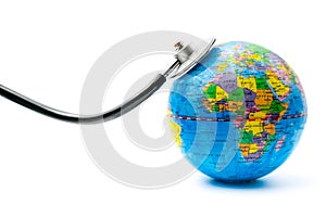 Detail of globe and stethoscope on white background, environmental emergency concept, global health monitoring