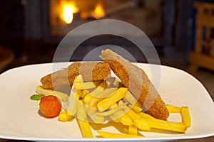 Detail of golden fried cheese with chips