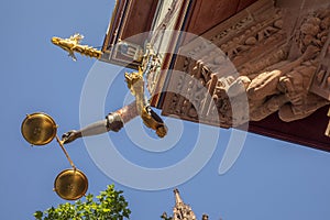 Detail of the golden scale, the most expensive house of the reconstructed new old town in Frankfurt