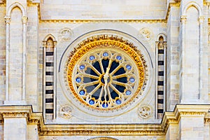Detail of golden watch on the Basilique Saint-Denis. photo