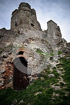 Detail of gothic tower of castle Levice with entrance to catacombs.