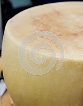 detail of grana padano cheese in a market