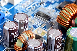 Close-up of inductors, capacitors and chips photo