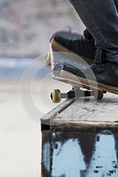 Detail of a grind with skateboard