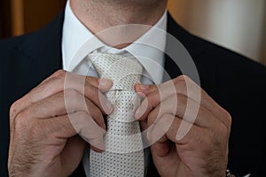 detail of the groom's suit on the wedding day