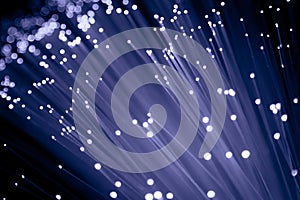 Detail of growing bunch of optical fibers background, fast light