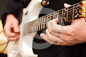 Detail of guitarist hands.