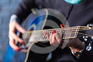 Detail of a guitarist playing a classical guitar