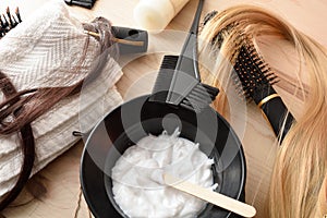 Detail of hair treatment products on wooden table top view