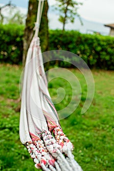 A Detail of a Hammock at the Lago di Garda in the Background