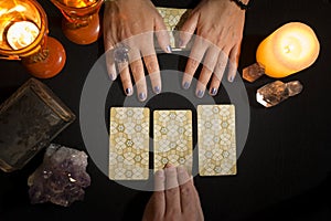 Detail of a hand choosing a lucky card