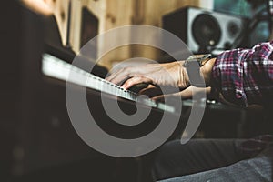 Detail of a hand playing a piano. Pianist concept