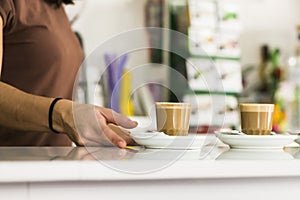 Detail of the hand of a waitress. photo