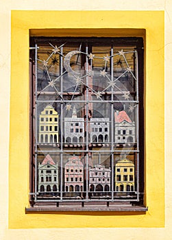 Detail of a handcrafted window with metal grid. Cesky Krumlov, Bohemia, Czeh republic.