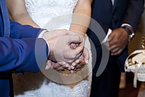 Detail of the hands of the bride and groom