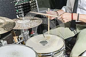 Detail of the hands of a man playing the drums