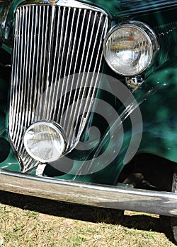 Detail of the headlamp and grill of 1930`s classic car