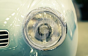 Detail on the headlight of a vintage car