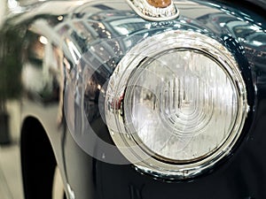 Detail on the headlight of a vintage car