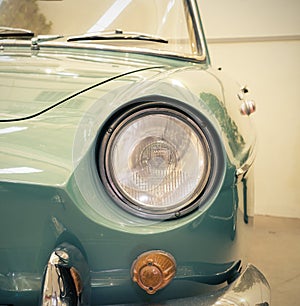 Detail on the headlight of a vintage car