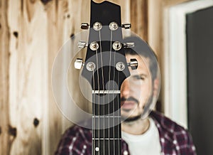 Detail of a headstock of a classical guitar. Music and guitarist