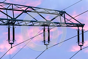 Detail of a high voltage power cable during sunset