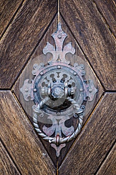 Detail of a historic knocker on the door. Made in the Czech Republic.