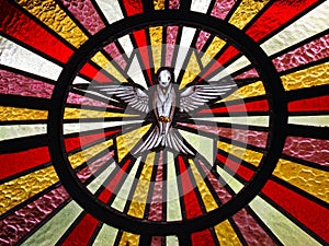 Detail of Holy Spirit stained glass in church door