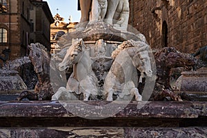 Detail of horses of the Neptune fountain, in Florence, Italy at dusk.