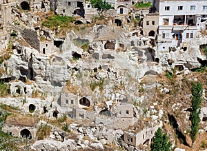 detail of the houses carved in the stone, living caves, Ortahisar, typical village carved in rock and stone, Cappadocia, Anatolia
