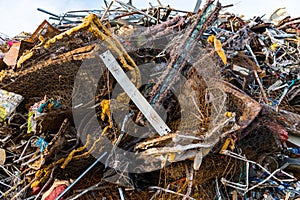 Detail of a huge mountain of mainly metal garbage and appliances in a junkyard