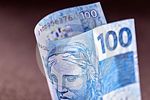 Detail of a hundred reais bill from brazil, concept of economy of brazil, profit or grand prize photo