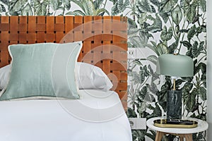 Detail image of a bedroom with woven brown leather headboard