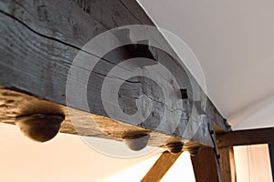 Detail of an interior wooden beam in ceiling