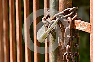 Gate closed with chain and padlock photo